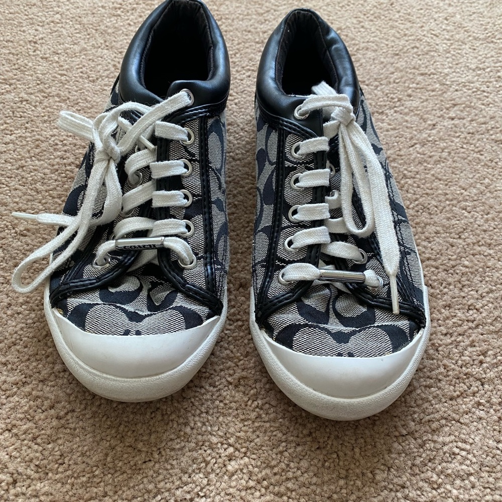 Coach sneakers. These are so cute to wear. Has some wear on the soles.